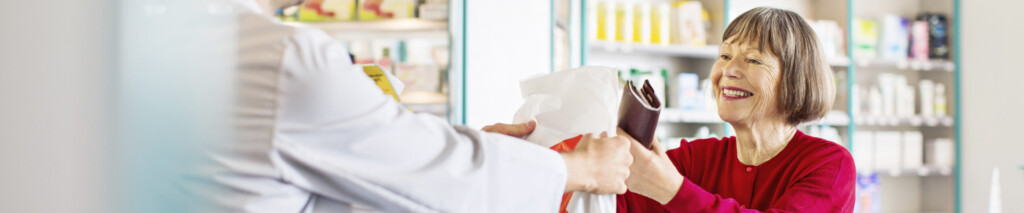 senior woman picking up her medication